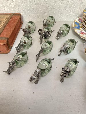 Lot 5102 - A set of ten pewter mounted Ngwenya glass napkin rings, each cast with African animals