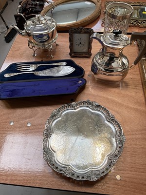 Lot 5153 - Group of silver and silver plate, including a silver mounted quartz clock retailed by R. Carr, a silver mounted cut glass vase, silver plated spirit kettle, etc