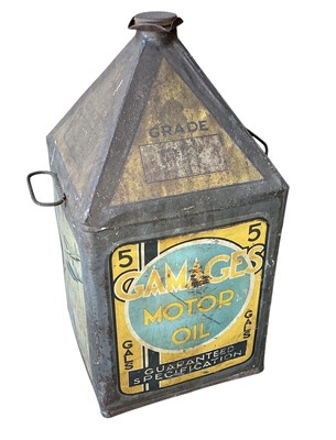 Lot 9 - Original 1930s Gamages motor oil can, with decorated panels depicting aircraft, boats and cars, 51cm in overall height