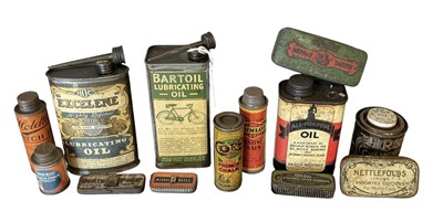 Lot 23 - Collection of fourteen assorted vintage cycle oils and lubricants in bottles and tins to include Dunlop and John Bull (14)