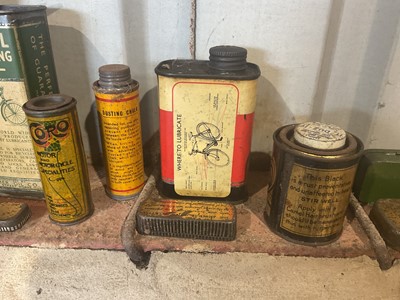 Lot 23 - Collection of fourteen assorted vintage cycle oils and lubricants in bottles and tins to include Dunlop and John Bull (14)