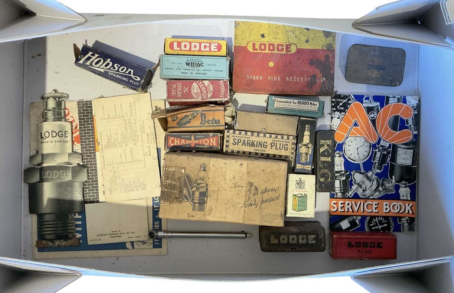Lot 32 - Collection of vintage spark plugs to include Lodge and Champion, with original packaging and ephemera