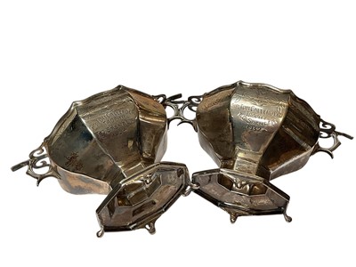 Lot 36 - Pair of 1920s silver two handled pedestal bowls with engraved decoration and presentation inscriptions (London 1928), 7cm high x 13.5cm overall width
