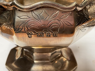 Lot 36 - Pair of 1920s silver two handled pedestal bowls with engraved decoration and presentation inscriptions (London 1928), 7cm high x 13.5cm overall width