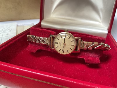 Lot 53 - 1970s Omega 9ct gold cased ladies' wristwatch on an Excalibur gold plated expandable bracelet, in original boxes with paperwork and original receipt dated 25/8/72.