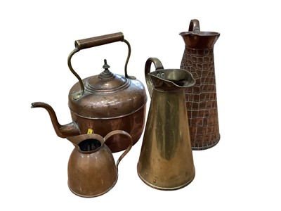 Lot 5024 - Three copper jugs and a copper kettle (4)