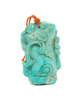Lot 31 - Formerly the property of William Tallon R.V.M., Antique Chinese carved bluestone pendant of naturalistic trunk form with floral and leaf decoration on silk cord suspension 5.5 x 3cm Sold by thes...