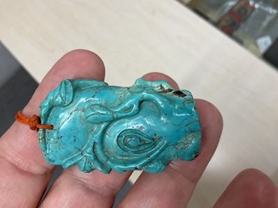 Lot 31 - Formerly the property of William Tallon R.V.M., Antique Chinese carved bluestone pendant of naturalistic trunk form with floral and leaf decoration on silk cord suspension 5.5 x 3cm Sold by thes...
