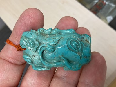 Lot 31 - Formerly the property of William Tallon R.V.M., Antique Chinese carved bluestone pendant of naturalistic trunk form with floral and leaf decoration on silk cord suspension 5.5 x 3cm Sold by thes...