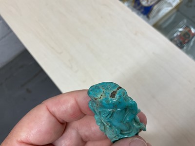 Lot 31 - Formerly the property of William Tallon R.V.M., Antique Chinese carved bluestone pendant of naturalistic trunk form with floral and leaf decoration on silk cord suspension 5.5 x 3cm Sold by thes...