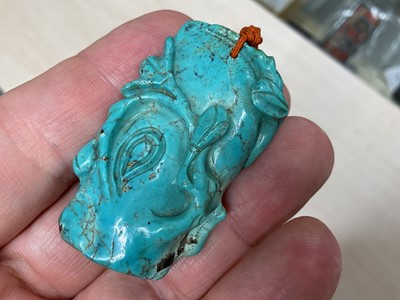 Lot 31 - Formerly the property of William Tallon R.V.M., Antique Chinese carved bluestone pendant of naturalistic trunk form with floral and leaf decoration on silk cord suspension 5.5 x 3cm Sold by thes...