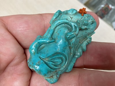 Lot 31 - Formerly the property of William Tallon R.V.M., Antique Chinese carved bluestone pendant of naturalistic trunk form with floral and leaf decoration on silk cord suspension 5.5 x 3cm Sold by thes...