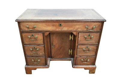 Lot 1370 - George III mahogany kneehole desk with an arrangement of seven drawers about a central cupboard kneehole