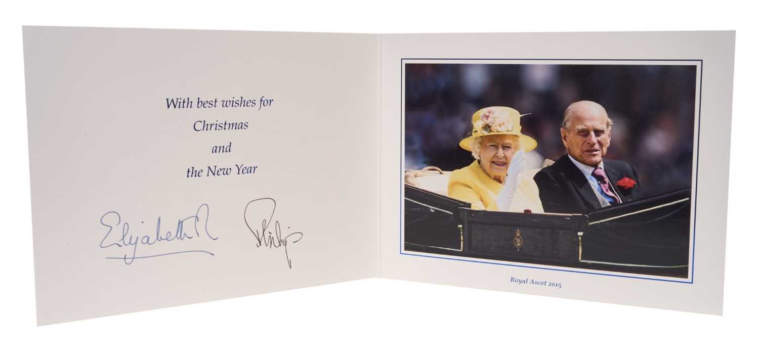 Lot 47 - H.M. Queen Elizabeth II and H.R.H. The Duke of Edinburgh signed 2015 Christmas card with twin gilt cyphers to cover, colour photograph of the smiling Royal couple riding in a carriage at Royal As...