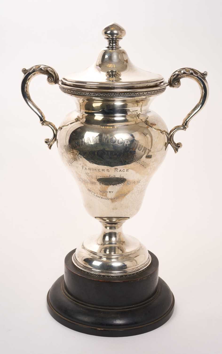 Lot 445 - George V silver two handled trophy cup and cover, with engraved presentation inscription ''Bramham Moor Hunt Point to Point Steeple Chases 4th April 1936 Farmers Race cup