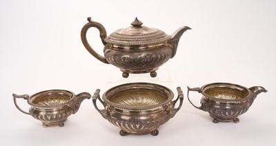 Lot George III silver teapot of cauldron form with fluted decoration and gadrooned border, fruitwood finial and handle, raised on four ball feet