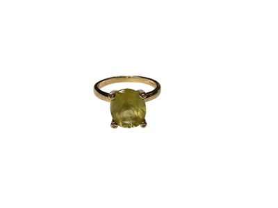 Lot 275 - 9ct gold citrine ring with an oval mixed cut stone in four claw setting on 9ct gold shank (Birmingham 2007), size N