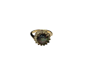 Lot 277 - 9ct gold mystic topaz ring with a border of synthetic white stones in claw setting, size N½