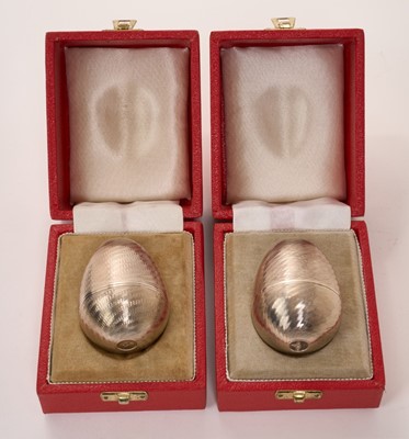Lot Two silver surprise eggs in the manner of Stuart Devlin, marked for Nicholas Plummer
