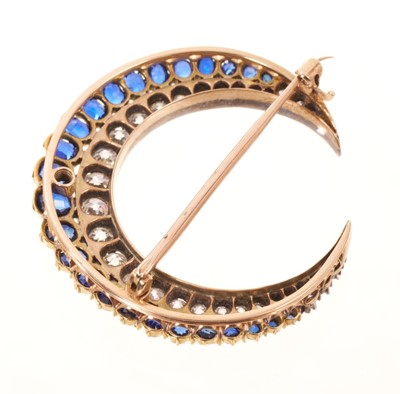 Lot 551 - A fine Victorian diamond and sapphire crescent brooch with graduated old cut diamonds and graduated oval mixed cut blue sapphires in silver and gold setting with pierced gold gallery and detacha...