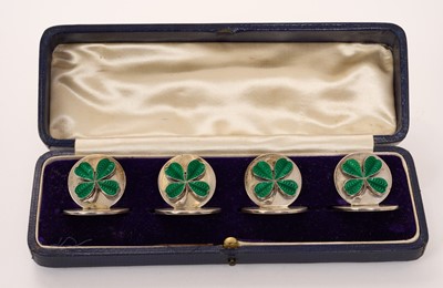 Lot Set of four early George V silver and enamel menu holders mounted with green enamelled shamrocks