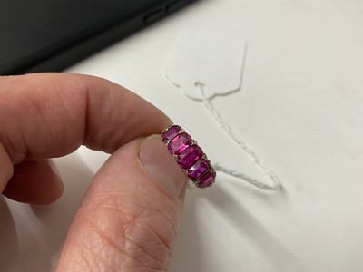 Lot 558 - Victorian ruby five stone half hoop ring with five graduated rubies with rose cut diamond accents to the claws, in carved gold setting on tapered shank, ring size J½.