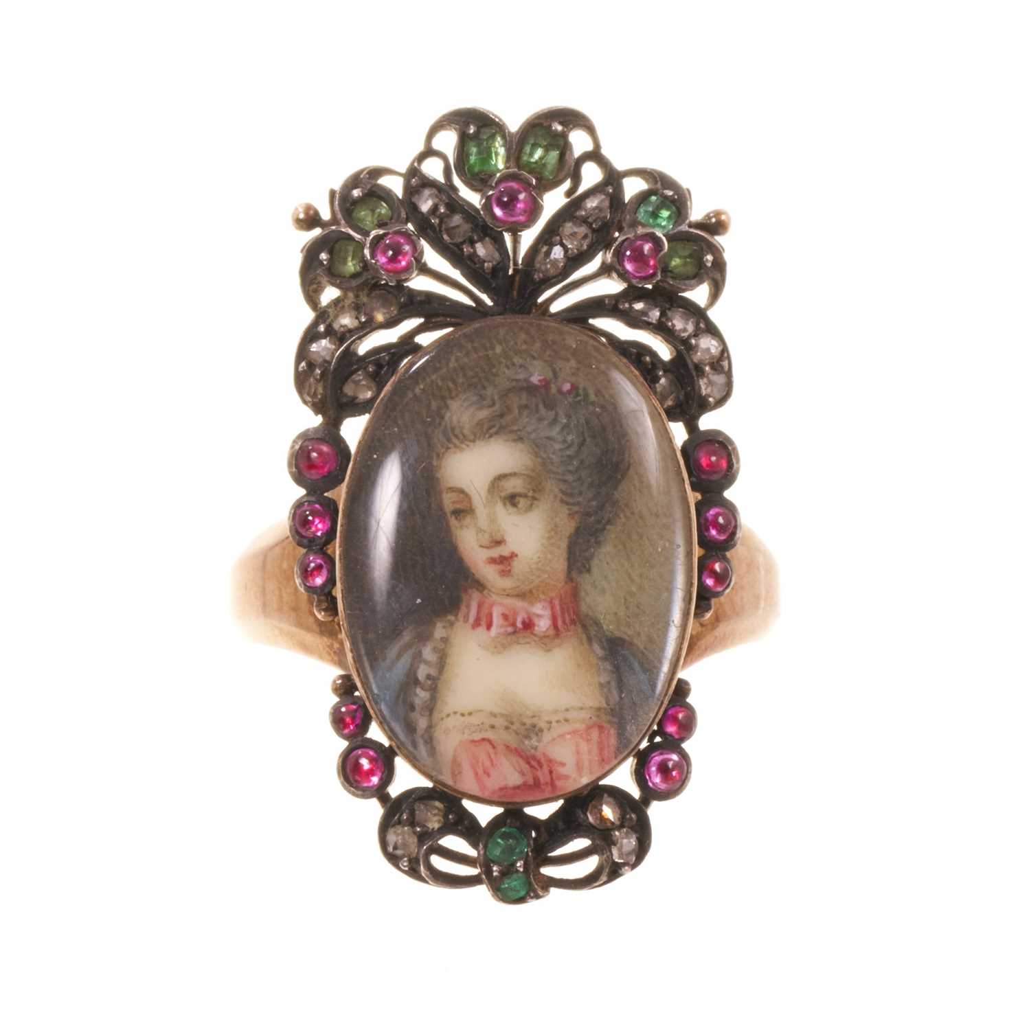 Lot 562 - Antique French ring with a portrait miniature on ivory depicting the bust of a young lady, the oval glazed bezel surmounted by pierced cresting and framed with diamonds, rubies and emeralds, on...