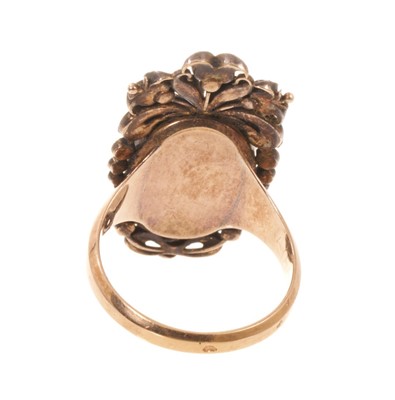 Lot 562 - Antique French ring with a portrait miniature on ivory depicting the bust of a young lady, the oval glazed bezel surmounted by pierced cresting and framed with diamonds, rubies and emeralds, on...