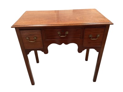 Lot 1457 - George III mahogany three drawer lowboy
