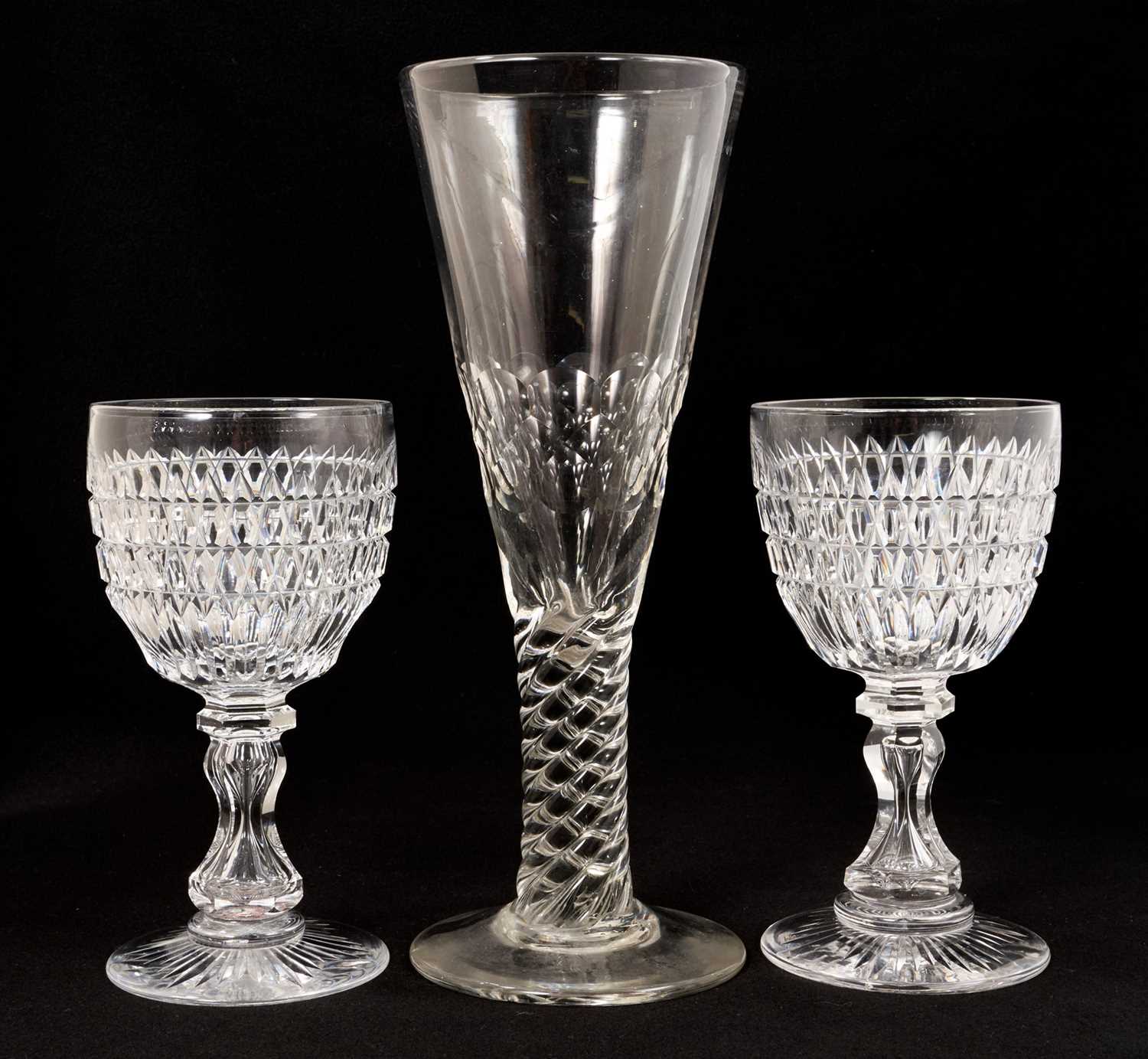 Lot 336 - Pair of good quality Victorian cut glass wine goblets, with annulated hourglass stems and star cut bases, 19cm high, together with an oversized flute glass with facet cut bowl and moulded twist...