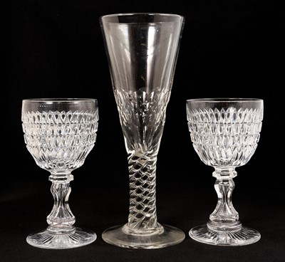 Lot Pair of good quality Victorian cut glass wine goblets, with annulated hourglass stems and star cut bases, 19cm high, together with an oversized flute glass with facet cut bowl and moulded twist...