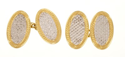 Lot Pair of 1920s 18ct gold and platinum cufflinks with engine turned oval panels