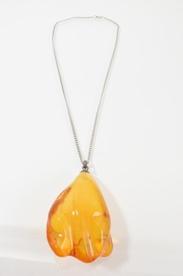 Lot 700 - Large amber pendant, the freeform amber measuring approximately 8cm x 5.8cm