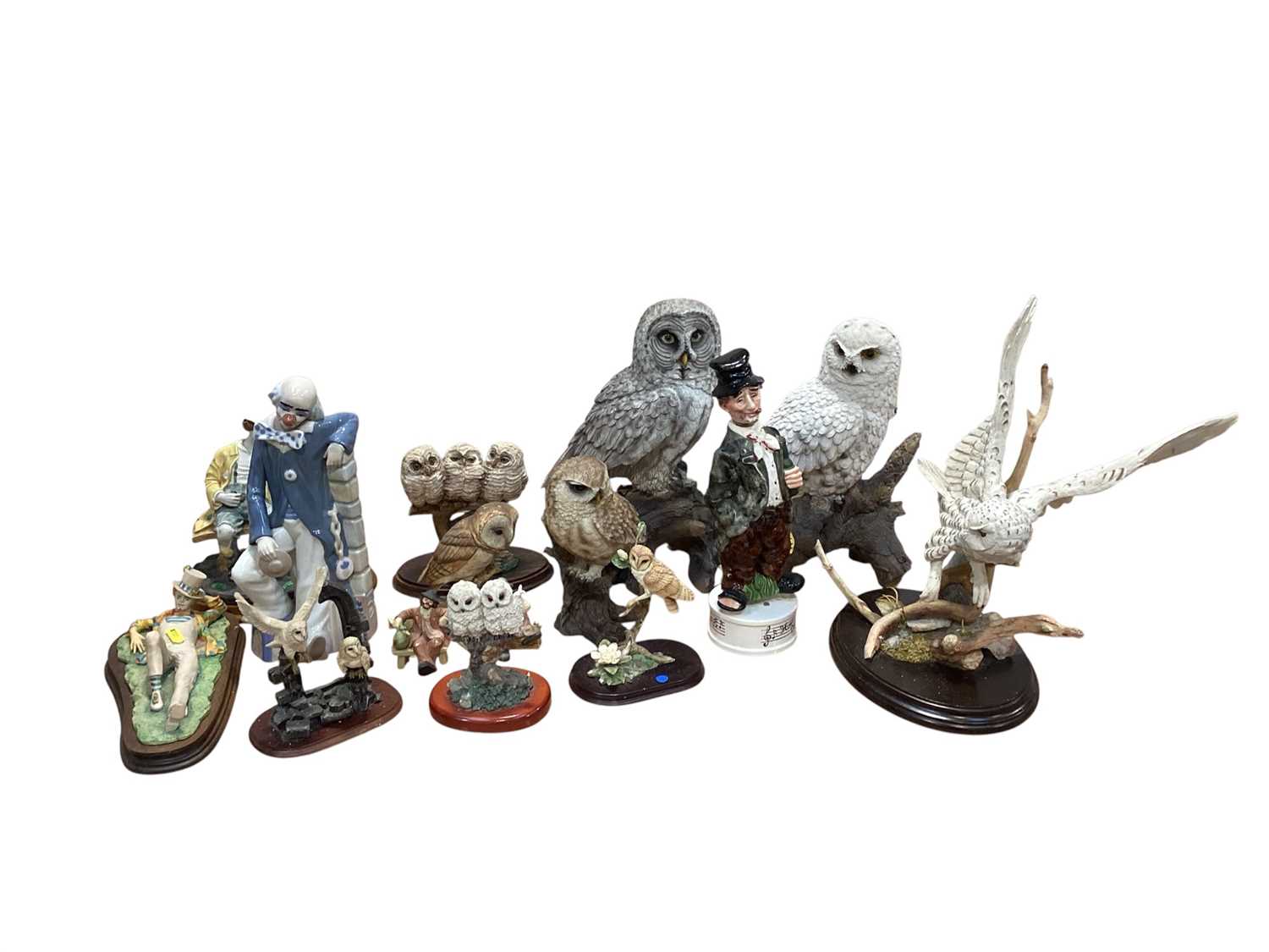 Lot 5086 - Group of resin owls together with resin and ceramic figures of clowns
