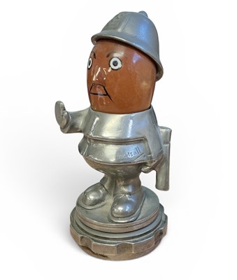 Lot 48 - Early 20th century 'Bobby' Policeman car mascot, with moving ceramic head, signed Hassall, mounted on a radiator cap, 14cm in overall height