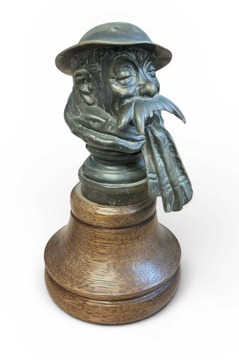 Lot 49 - Early 20th century Bruce Bairnsfather 'Old Bill' brass car mascot, stamped signature 'Bruce Bairnsfather' to the reverse, also stamped Reg. No. 669204, copyright to underside, mounted on a turne...