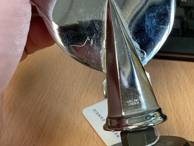 Lot 50 - British Racing Drivers' Club (BRDC) chromium and enamel members' car badge, stamped Collins, London to reverse, later mounted on a plastic stand, 12.5cm in overall height (excluding stand)