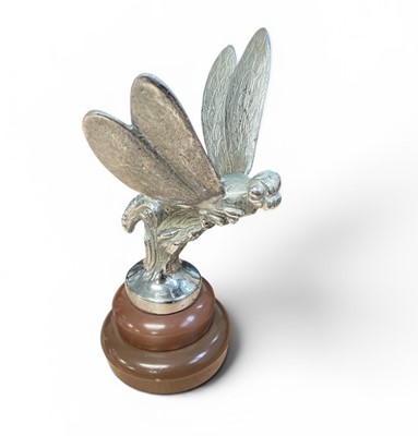 Lot 51 - Vintage chromium plated car mascot in the form of a dragonfly, later mounted on a plastic base, mascot 13cm in height (excluding base)