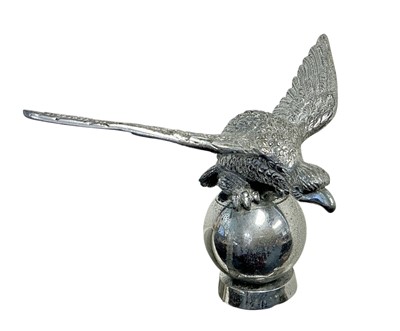 Lot 55 - Vintage Desmo chromium plated car mascot in the form of an eagle on a ball, with screw fitting to base, wingspan 18cm in diameter