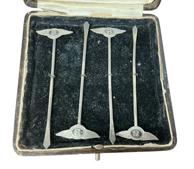 Lot 93 - Set of four 1930s silver cocktail sticks, each mounted with a Bentley winged B logo and stamped 'Sterling Silver', in a fitted case, each 8.5cm in overall length