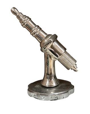 Lot 106 - Polished metal car mascot in the form of a spark plug, 11.5cm in overall height (excluding base)