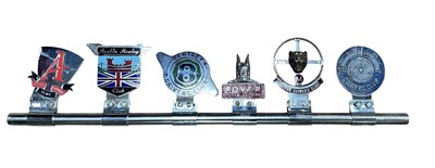 Lot 117 - Group of six assorted car grill badges for various car clubs, mounted on a badge bar, to include Rover Sports Register, Austin Healey Club and Jaguar Drivers' Club