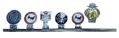 Lot 118 - Group of five assorted car grill badges relating to Jersey, mounted on a badge bar, to include Jersey Motor Association, together with a loose AA badge for Jersey (6 badges)