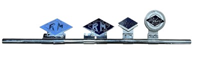 Lot 119 - Group of four assorted Riley related car grill badges, mounted on a badge bar, to include Riley Motor Club