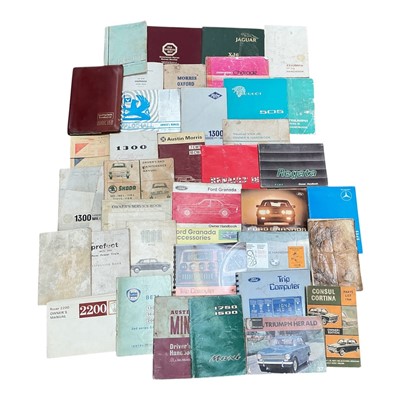 Lot 147 - Collection of assorted car handbooks and owners' manuals, together with a group of car-related books, including Stirling Moss "All my races", signed by author Alan Henry and a group of motorsport