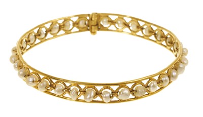 Lot 460 - Eastern yellow metal and pearl bangle