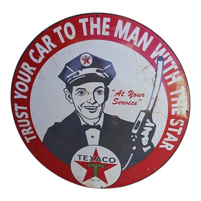 Lot 167 - Texaco "Trust your car to the man with the star", circular pictorial metal pump sign