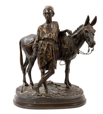 Lot Alfred Dubucand (1828-1894) - Bronze figure of an Arab and his donkey, signed, on integral naturalistic oval stepped plinth, 35cm high