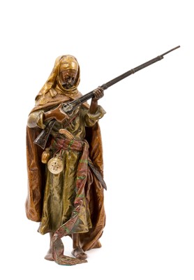 Lot 811 - Early 20th century Austrian cold painted bronze sculpture, by Franz Bergman, in the form of a Arab Warrior, signed with Bergman monogram in amphora vase, 19cm high. Provenance: Purchased Hickmet...
