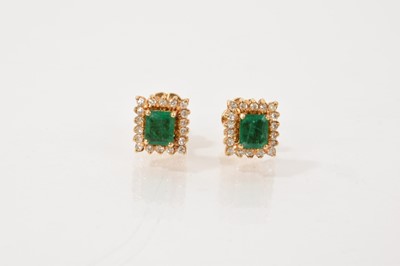 Lot 447 - Pair of emerald and diamond earrings